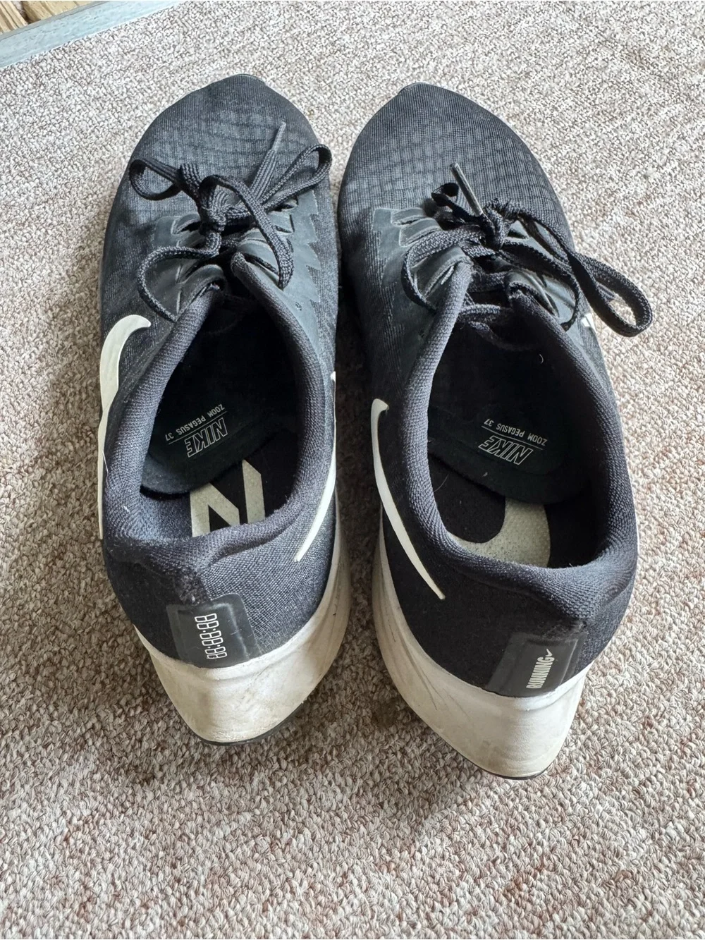 Nike Black Athletic Running Shoes with White Swoosh